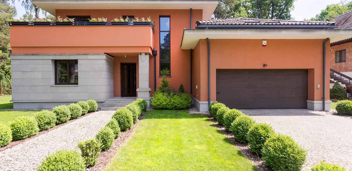 Travertine House with Pristine Lawn Care